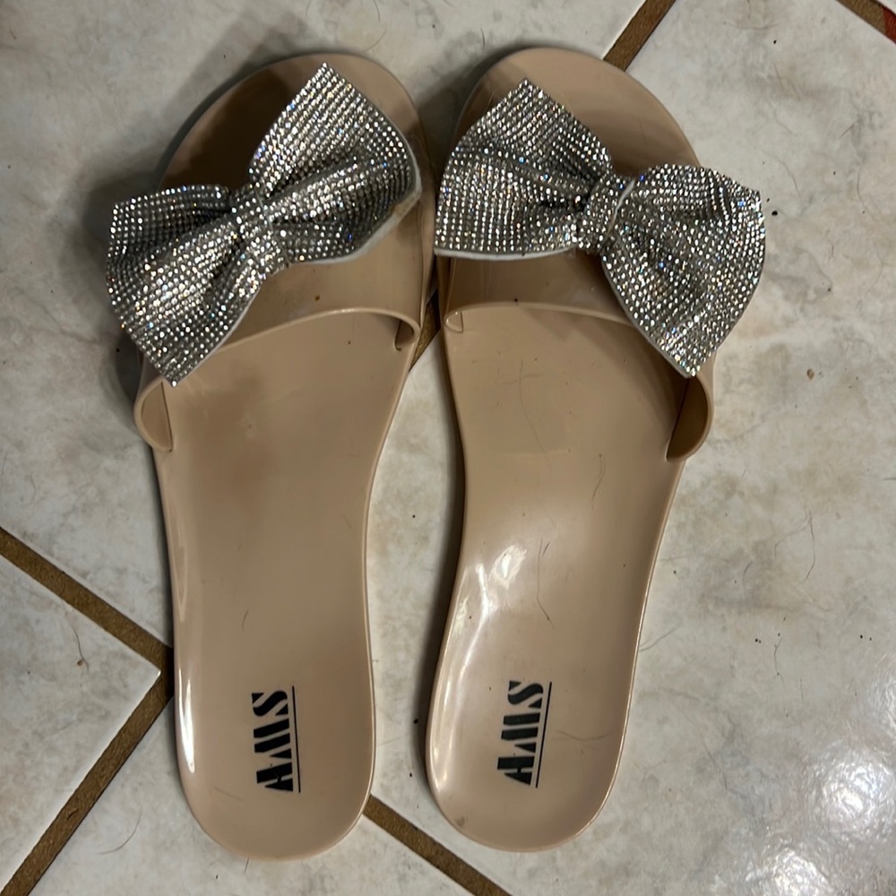 Jelly slip on size 10 with silver bows.